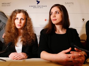 Russian punk band Pussy Riot members Maria Alyokhina, left, and Nadezhda Tolokonnikova address a news conference for the "Cinema for Peace" charity gala in Berlin, February 10, 2014. (REUTERS/Tobias Schwarz)