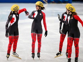 Canada's speed skating team celebrates after the women's 3,000 metres short track speed skating relay final event in the Iceberg Skating Palace at the Sochi 2014 Winter Olympic Games February 18, 2014. (REUTERS)
