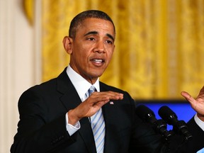 U.S. President Barack Obama speaks during an event at the White House in Washington on February 12, 2014. (REUTERS/Kevin Lamarque)