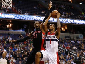 Washington Wizards small forward Trevor Ariza shoots the ball as  Raptors small forward Terrence Ross defends in the first quarter in Washington on Tuesday. (Geoff Burke/USA TODAY Sports)