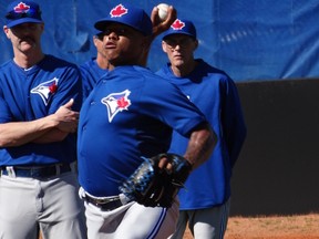 Blue Jays staff keeps a watchful eye on pitcher Marcus Stroman as he throws in Dunedin yesterday. Stroman is hoping to be chosen as the team’s fifth starter. (Eddie Michels/Photo)