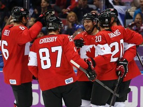 Canada's Drew Doughty (C) celebrates his goal on Finland with teammates during the first period of their men's preliminary round ice hockey game at the Sochi 2014 Winter Olympic Games February 16, 2014. (REUTERS)
