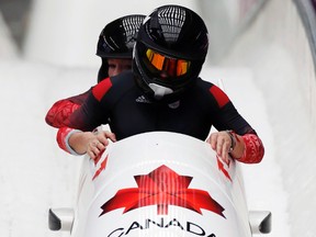 Canadian bobsledders Kaillie Humphries and Heather Moyse will compete for a spot on the podium Wednesday. (FABRIZIO BENSCH/Reuters)