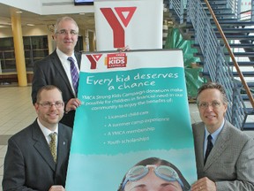 With the YMCA Strong Kids Campaign banner, at the YMCA Jerry McCaw Family Centre in Sarnia, are Gamble Insurance president Barry Hogan, front left, Southwestern Ontario YMCAs CEO Jim Janzen, and Economical Insurance media relations manager Doug Maybee. The 2014 campaign to raise $266,500 was launched on Wednesday, Feb. 19, 2014 and Economical Insurance has donated $25,000 toward the goal.
DAVID PATTENAUDE/QMI AGENCY