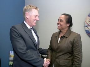 Jim Keech, president and CEO of Utilities Kingston with Hersh Sehdev, director of KIngston Community Health Centres on Wednesday after donating $30,000 towards the LEAP program to help people pay their utility bills. 
IAN MACALPINE/KINGSTON WHIG-STANDARD/QMI AGENCY