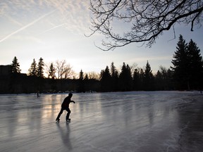 A skater makes the rounds as the sun sets at Victoria Park Oval in Edmonton, Alberta on Thursday, December 8, 2011. AMBER BRACKEN/EDMONTON SUN/QMI AGENCY