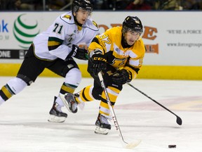 Kingston Frontenacs forward Corey Pawley, in action against London earlier this season, and diminutive linemates Darcy Greenaway and Robert Polesello have been helping the Frontenacs' offence lately. (QMI Agency)