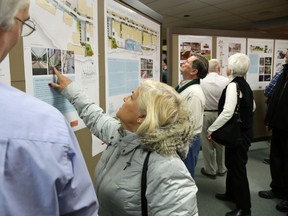 JASON MILLER/The Intelligencer
Aurora Mancuso checks out Build Belleville plans Wednesday night during a public meeting.