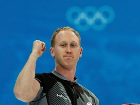 Canada's skip Brad Jacobs gestures after winning their men's curling semifinal game against China at the 2014 Sochi Winter Olympics in the Ice Cube Curling Center in Sochi February 19, 2014.   (REUTERS)