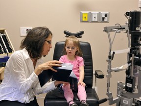 Pediatric ophthalmologist Dr. Inas Makar of the Ivey Eye Institute examines Emma Salisbury at St. Joseph's Hospital in London, Ont. (Photo submitted).