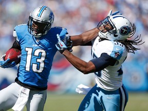 Nate Burleson of the Detroit Lions runs after a reception against Michael Griffin #33 of the Tennessee Titans during the game at LP Field on September 23, 2012 in Nashville, Tennessee. (Joe Robbins/Getty Images/AFP)