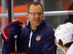 Dan Bylsma (L) of the U.S. talks to T.J. Oshie during a team practice at the 2014 Sochi Winter Olympics February 20, 2014.  (REUTERS)