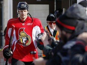The Ottawa Senators hockey team took to the ice at Jules Morin Park in Ottawa for an outdoor practice on Thursday February 20, 2014. Jason Spezza, passes fans as he walks to the ice. Darren Brown/Ottawa Sun/QMI Agency