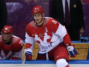 Alexander Ovechkin's father had heart surgery during the Winter Olympics in Russia, which may delay the Capitals star's return to Washington. (Al Charest/QMI Agency)