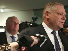 Councillor Doug Ford and his brother Mayor Rob Ford hold a press conference on Thursday February 20, 2014 outside of the mayor's office at City Hall in Toronto. (Veronica Henri/Toronto Sun)