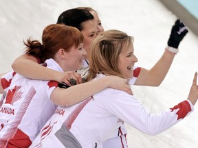 Canada's skip Jennifer Jones, first Dawn McEwen, second Jill Officer and vice Kaitlyn Lawes (front-back) celebrate after winning their women's gold-medal curling game against Sweden at the Ice Cube Curling Centre during the Sochi 2014 Winter Olympics February 20, 2014.  (REUTERS)