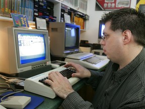 Syd Bolton prepares a Commodore VIC-20 to tweet at the Personal Computer Museum in this Feb. 19, 2010 file photo. (CHRISTOPHER SMITH/QMI Agency)