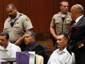 Marvin Norwood (seated left) and co-defendant Louie Sanchez  (seated right) plead guilty to charges stemming from the severe beating of San Francisco Giants fan Bryan Stow. (Irfan Khan/Reuters/Pool)