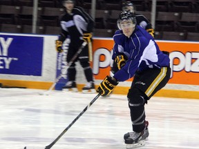 Sarnia Sting forward Alexandre Renaud braces himself to accept a pass during practice on Thursday, Feb. 21. The sophomore winger will be returning to the line up for the first time in 18 games on Friday night after battling mononucleosis. SHAUN BISSON/THE OBSERVER/QMI AGENCY
