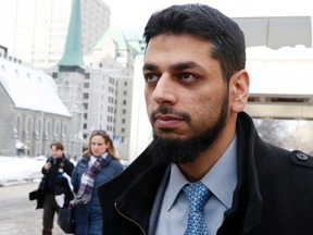 Accused terrorist, Dr. Khurram Syed Sher, is photographed leaving the Ottawa court house on Monday February 10, 2014.Darren Brown/Ottawa Sun/QMI Agency
