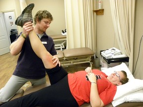 ERNST KUGLIN/The Trentonian
Registered physiotherapist Kyle Meringer treats patient Amanda MacLeod at Trenton Sports Therapy and Massage. The clinic received designation as a community physiotherapy centre from the Ministry of Health, in order to provide OHIP covered services.