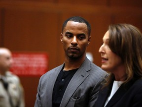 Former NFL player Darren Sharper looks at his attorney, Blair Berk, during his arraignment at the Clara Shortridge Foltz Criminal Justice Center in Los Angeles, California February 20, 2014. (REUTERS/Mario Anzuoni)