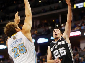 Nando De Colo, acquired by the Toronto Raptors on Feb. 20, 2014, shots the ball during his time with the San Antonio Spurs. (CHRIS HUMPHREYS/USA TODAY Sports)