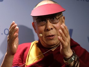 The Dalai Lama addresses the American Enterprise Institute in Washington February 20, 2014.  REUTERS/Gary Cameron