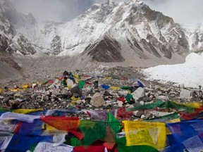 Buddhist prayer flags flutter in the wind with Everest base camp seen in the background, May 03, 2011.   REUTERS/Laurence Tan, FILE