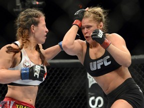 Ronda Rousey and Miesha Tate fight during their UFC women's bantamweight championship bout at the MGM Grand Garden Arena. (Jayne Kamin-Oncea/USA TODAY Sports)