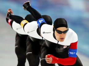 Canada's Denny Morrison leads his teammates in the men's speed skating team pursuit semifinals during the 2014 Sochi Winter Olympics, Feb. 21, 2014. (PHIL NOBLE/Reuters)