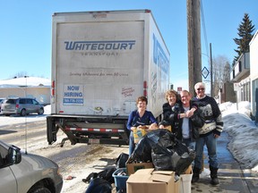 Whitecourt Transport Driver, Dave Hutchinson, Vall Scott, Trudy Dorward, Brian Roth and Bob Walker help load up old hockey equiptment. Whitecourt Transport will bring the equipment to Edmonton where a business will cleanup the equipment before it makes its final trip to a town in the North West Territories.
Barry Kerton | Whitecourt Star