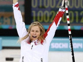 Canada's skip Jennifer Jones jumps into the air after beating Great Britain to win the women's curling gold medal at the Sochi 2014 Winter Olympics, Feb. 19, 2014. (AL CHAREST/QMI Agency)