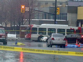 A 26-year-old woman is dead after she was hit by a transport truck at Waller St. and Rideau St. shortly after 6 a.m. on Friday, Feb. 21, 2014. Police are looking for the driver of a transport truck in connection with the crash. 
(Danielle Bell/Ottawa Sun/QMI Agency)