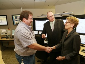 Mark Bardswich, left, Totten Mine operations control centre supervisor, greets Ontario Premier Kathleen Wynne as Bob Booth, mine manager of Totten Mine, looks on at the official opening of Vale's Totten Mine in Worthington in this file photo. John Lappa/The Sudbury Star/QMI agency