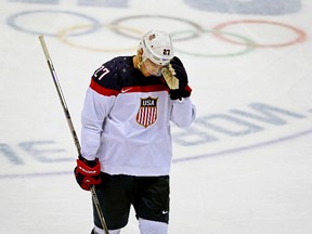 Team USA's Ryan Mcdonagh skates back to the bench during their men's hockey semifinal game against Canada at the Sochi 2014 Winter Olympics, Feb. 21, 2014. (AL CHAREST/QMI Agency)