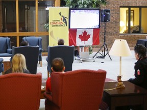 Delegates to the Ontario Coaches Conference in Kingston take a break to watch the Canada-United States hockey game Friday at the Ambassador Hotel and Conference Centre in Kingston.
Elliot Ferguson The Whig-Standard