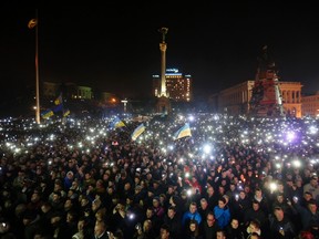 Anti-government protesters light torches and mobile devices during a rally in central Independence Square in Kiev February 21, 2014.  (REUTERS/Baz Ratner)