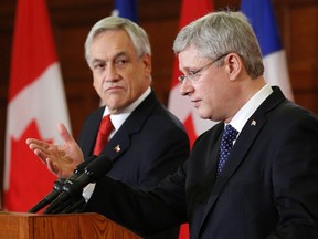 Canada's Prime Minister Stephen Harper speaks during a news conference with Chile's President Sebastian Pinera on Parliament Hill in Ottawa May 30, 2013.    
REUTERS/QMI Agency