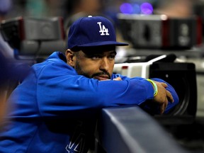 Los Angeles Dodgers center fielder Matt Kemp watches from the dugout in the first inning against the San Diego Padres in their MLB National League baseball game in San Diego, California September 20, 2013. (REUTERS/Alex Gallardo)