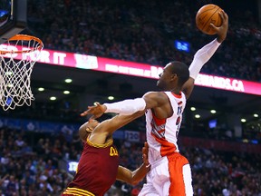 Terrence Ross of the Toronto Raptors gets a shot up past Jarrett Jack of the Cleveland Cavaliers at the ACC on Friday. (Dave Abel/Toronto Sun/QMI Agency)