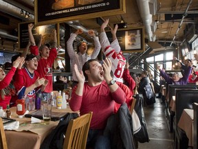 Fans at Jack Astor?s on Richmond St. exult as Canada defeats the U.S. 1-0 in Friday?s Olympic men?s hockey semifinal. (CRAIG GLOVER, The London Free Press)