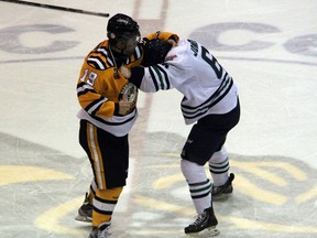 Matteo Ciccarelli of the Sarnia Sting (left) and Mitch Jones of the Plymouth Whalers square off in a tilt at centre ice during the 2nd period of their game at the RBC Centre on Friday night. CIccarelli's fight sparked a goal by the Sting that tied the game 2-2, but Sarnia would ultimately fall 3-2. (SHAUN BISSON, The Observer)