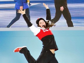 Canadian silver medallist Kelsey Serwa jumps during the medal ceremony for the women's skicross event at the 2014 Sochi Winter Olympics, Feb. 21, 2014. (SHAMIL ZHUMATOV/Reuters)
