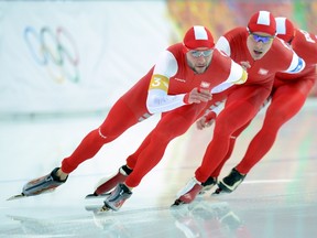 (L-R) Poland's Konrad Niedzwiedzki, Poland's Jan Szymanski and Poland's Zbigniew Brodka compete in the men's speed skating team pursuit final B at the Adler Arena during the Sochi Winter Olympics on February 22, 2014.  (AFP PHOTO / JUNG YEON-JE)