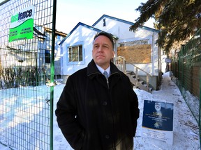 Chip Sawchuk, Manager, SCAN Unit stands in front of a closed drug house on 90 St., and 120 Ave., in Edmonton, Alberta on  Thursday, Feb 19, 2014. Safer Communities and Neighbourhoods (SCAN) have closed down the house and evicted the residents for the next 90 days. Perry Mah/Edmonton Sun/QMI Agency