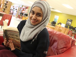 Northern student Naima Raza relaxes with Khaled Hosseini's "A Thousand Splendid Suns." She said the Afghan-born American novelist has penned some of her favourite books, including "The Kite Runner." BARBARA SIMPSON/THE OBSERVER/QMI AGENCY