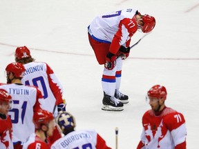 Russia's Anton Belov reacts after his team's loss to Finland in their men's quarter-finals ice hockey game at the 2014 Sochi Winter Olympic Games, February 19, 2014.                  REUTERS/Laszlo Balogh (RUSSIA  - Tags: OLYMPICS SPORT ICE HOCKEY)