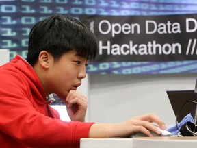 Henry Wang, 13, takes part in the International Open Data Day Hackathon at the Stanley A. Milner Library, in Edmonton on Saturday. (DAVID BLOOM/ /Edmonton Sun)
