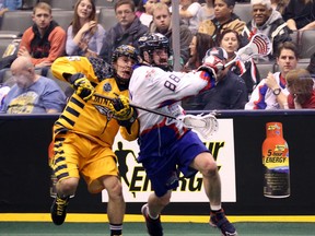 The Rock’s Scott Johnston (right) fights off Minnesota Swarm’s Jason Noble during first-half NLL action at the Air Canada Centre last night. (Michael Peake/Toronto Sun)
